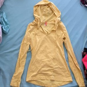 Yellow hooded long sleeve yoga top